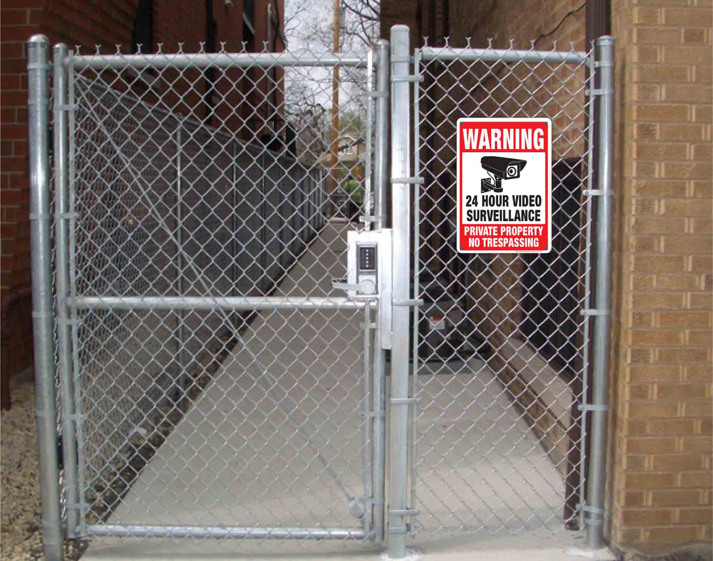 24 Hour Video Surveillance Signs - Private Property aluminum sign and vinyl sticker signs installed on fence.