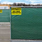 caution area under construction signs installed on fences.